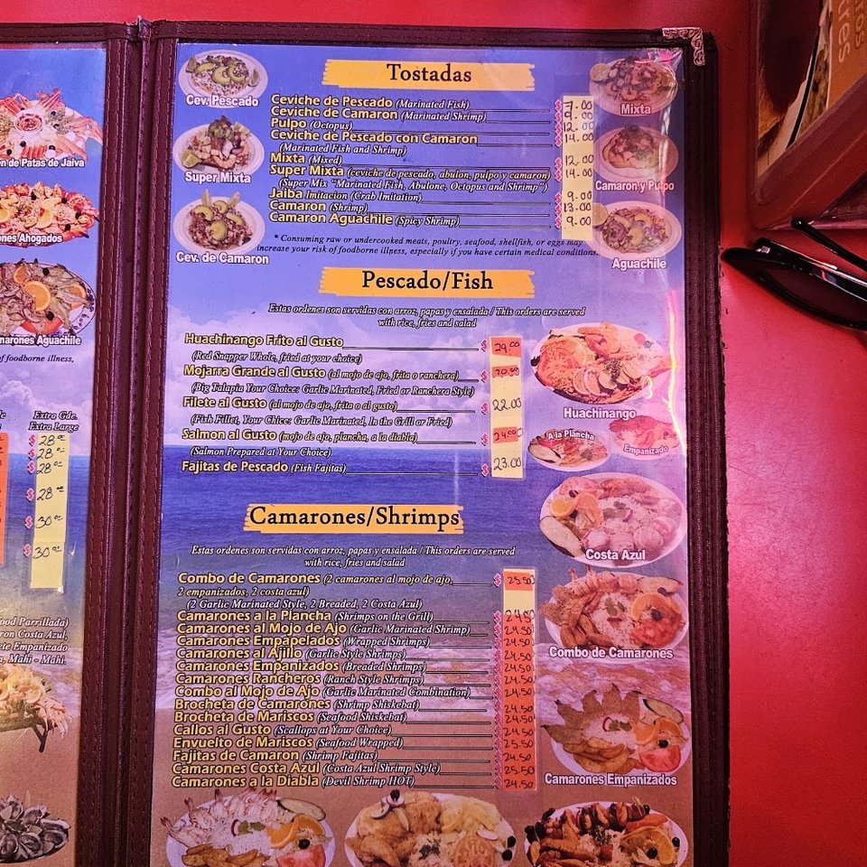 Seafood menu featuring cocktails, soups, and tacos.